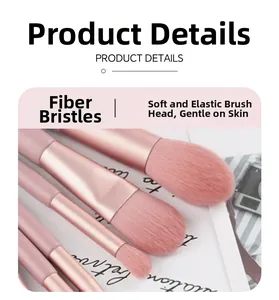 Detail of pink makeup brushes showing soft fiber bristles and sleek metallic handles