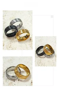Close-up of 8mm stainless steel rings for men with textured diagonal parallel grooves