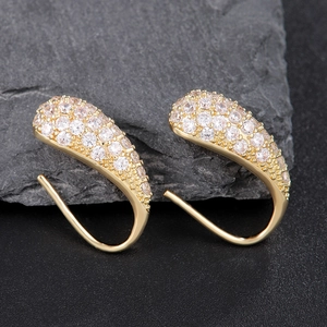 Exquisite gold teardrop hook earrings with cubic zirconia set on dark grey stone