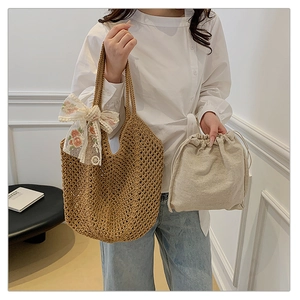 Detail of hand-woven hollow tote bag with delicate lace floral bow and inner pouch