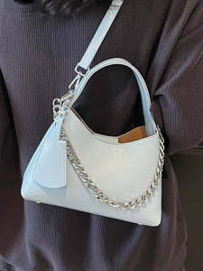 Chic light blue lychee texture bucket bag with silver chain and crossbody strap