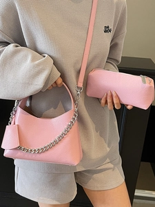 Pink lychee texture bucket bag with silver chain and crossbody strap for women