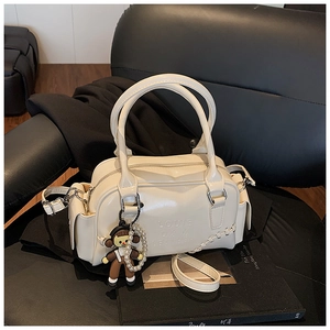 Chic cream bowling bag with LOUIE embossed logo and cute pearl girl pendant details