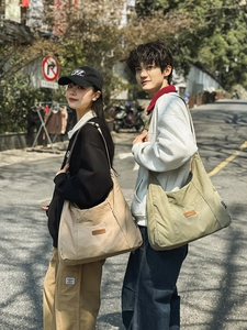 Outdoor shot of khaki and olive green large canvas tote bags for casual commuting style