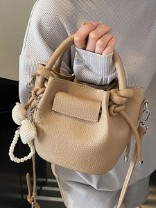 French style pleated bucket bag in litchi grain leather with pearl ribbon charms