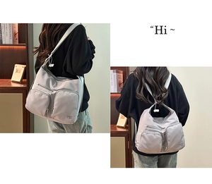Vielseitiger grauer Nylon-Rucksack und Umhängetasche mit vielen Taschen für den Alltag