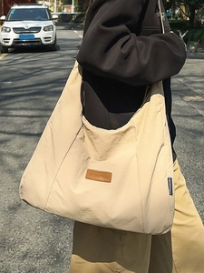 Minimalist beige oversized nylon tote bag with CHUANGMI logo for casual outdoor fashion