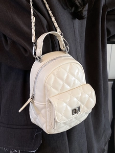 Quilted beige mini backpack with silver chain strap and metal lock for stylish women