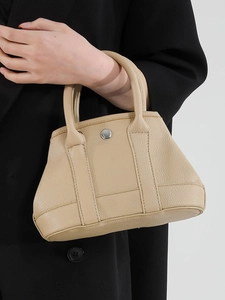 Minimalist beige lychee grain handbag with dual handles and magnetic clasp