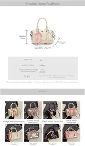 Detailed view of Boston pillow bag with PU leather floral embossing and lace bow charm