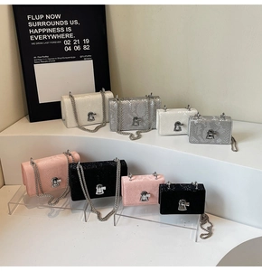 Size comparison of chain square bags in snakeskin embossed leather with metal locks