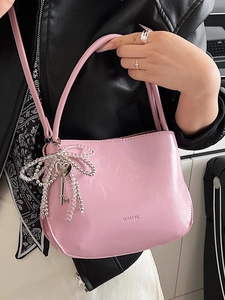 Chic pink PU leather bucket bag for women with beaded bow charm and shoulder strap