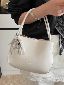 Minimalist white glossy PU bucket bag with beaded charm and CLEARYK logo for women