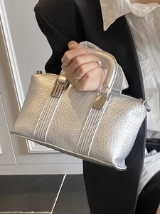 Minimalist silver square handbag with metallic texture and sleek top handle for women
