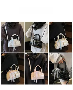 Collage of mini Boston bags in various colors featuring lace bows and double pockets