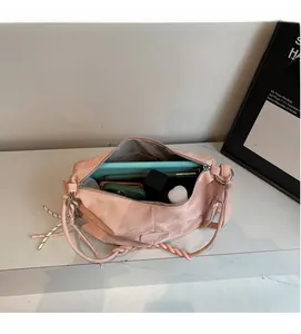 Pink nylon tote bag interior showing large capacity for phone and card holder storage