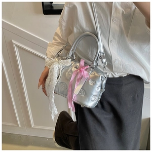 Silver metallic Boston bag featuring large lace bow and pink plaid ribbon decoration