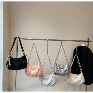 Chic hobo tote bags displayed in multiple colors featuring woven handles and long straps