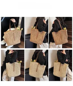 Detail of hollow woven straw tote bag with brown leather straps and spacious interior