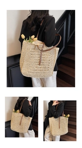 Detail of woven straw tote bag with brown leather straps and hollow texture design
