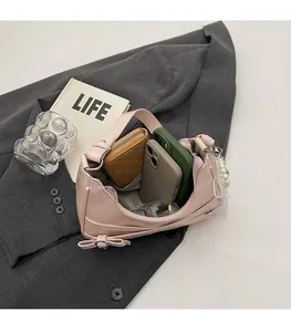 Interior view showing spacious storage capacity of pink PU leather shoulder bag