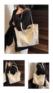 Detail of soft white tote bag with elegant lace bow decoration and matte leather finish
