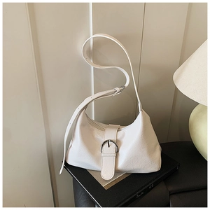 Detail of white moon-shaped hobo bag with metallic buckle closure and adjustable strap