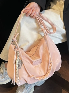 Chic pink nylon shoulder bag with woven handle and adjustable strap for women