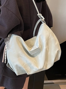 White cloud-style leather tote bag with pleated texture and adjustable knotted strap