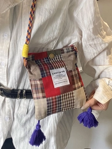 Retro plaid patchwork crossbody bag with purple tassels and woven shoulder strap