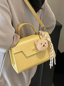 Minimalist yellow PU leather crossbody bag with cute bear charm and striped silk ribbon