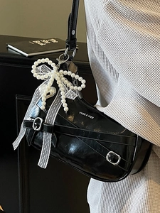 Glossy black dumpling underarm bag with silver buckle and pearl lace bow charm