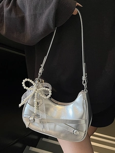 Silver metallic crescent underarm bag with pearl bow and lace charm decoration