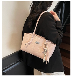 Pink faux leather tote bag featuring embossed cartoon bears and decorative scarf detail