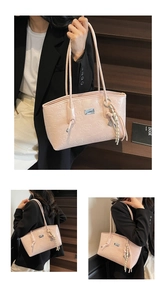 Close-up of pink hobo bag with embossed cartoon bears and bunnies and metal nameplate