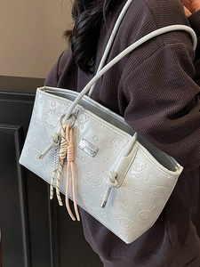 Chic light blue embossed hobo bag with cartoon patterns and woven strap detail