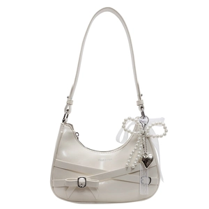 White crescent underarm bag with leather bow and pearl lace pendant on white background