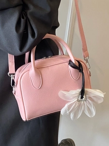Pink lychee texture Boston handbag for women with white flower charm and long shoulder strap