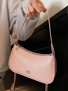 Pink woven texture shoulder bag with minimalist design for chic spring fashion accessories