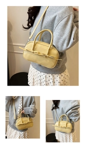 Détail du sac Boston jaune avec décoration en nœud et bandoulière amovible