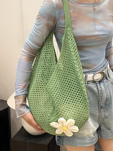 Green crochet tote bag with large daisy flower, woven hollow design for summer style