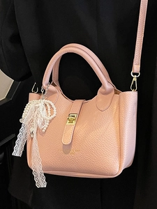 Pink litchi texture bucket bag with gold lock and pearl lace charm for women