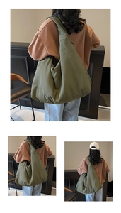 Dettaglio della grande borsa tote in nylon verde oliva che mostra la texture morbida e capiente