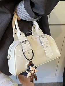 White Boston handbag in biker style with silver buckles and a cute cartoon charm