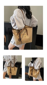 Detail view of retro canvas tote bag featuring cute cat embroidery and brown leather straps