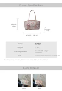 Detail view of lace butterfly embroidery and pearl bow pendant on this shoulder bag