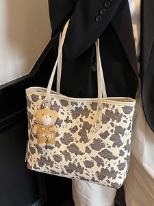 Retro cow print tote bag for women with cute bear charm and large capacity for daily use