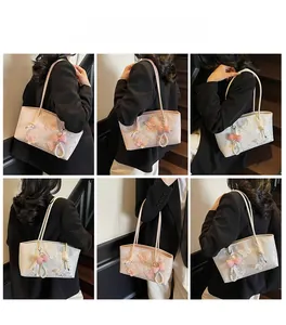 Collage of model wearing pink and white floral butterfly embroidery shoulder bags