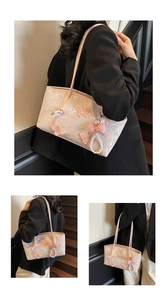 Close-up of pink shoulder bag with lace embroidery, 3D butterflies and pearl bow charm