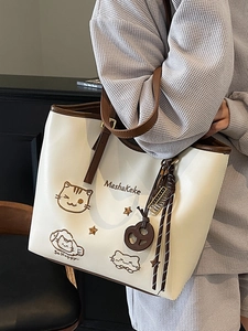 Cute beige tote bag with cat embroidery and trendy charms for casual daily wear